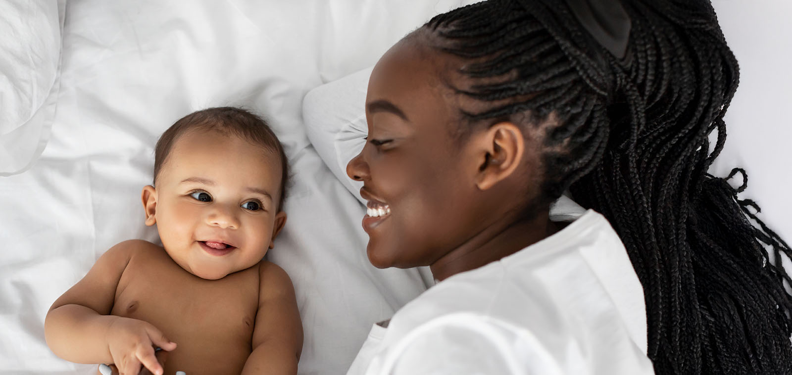 "Mom on bed with Baby"