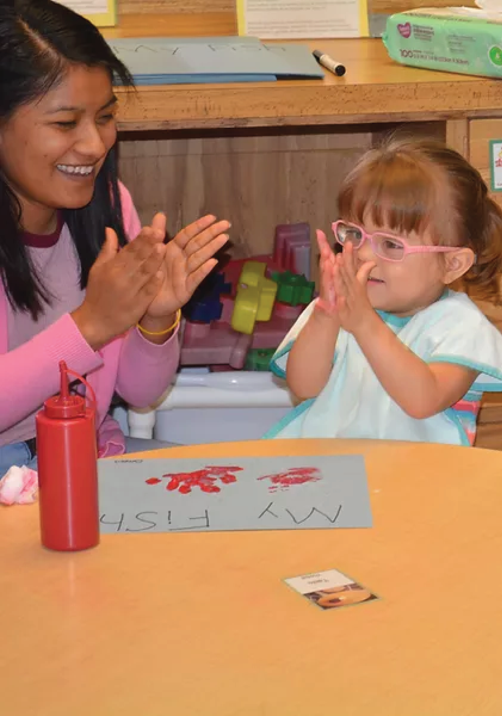 "Caregiver and Child with Art"